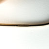 Close-up of 9ct rose gold earring wire stamped 375 with hallmark details visible