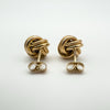 Back view of vintage rose gold knot earrings with new 9ct gold butterfly backs