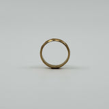 Upright view of vintage 18ct rose gold faceted band ring showing the full round profile.