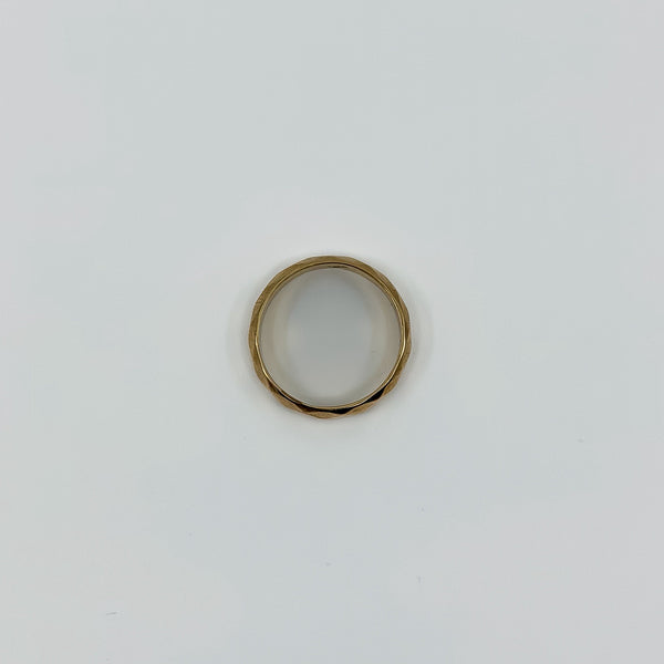 Top view of vintage 18ct rose gold faceted band ring showing the circular shape and polished finish.