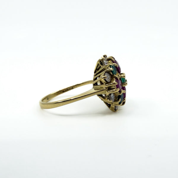 Side profile of 18ct gold ruby emerald and diamond cluster ring with open gallery setting