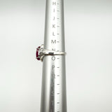 Sterling silver ruby ring shown on ring mandrel, size approximately N