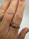 Gold-plated pavé ruby ring worn on finger, showing fit and sparkle