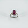 Three-quarter angle view showing height and sparkle of ruby halo design