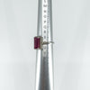 Size T ruby ring shown on ring sizer stick