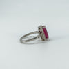 Side angle showing ruby centre stone and scrollwork setting details