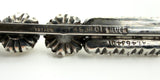 Macro photo of the SILVER stamp on the antique bar brooch, with faint patent number visible.