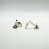 Side angle showing curve of sterling silver diamond earrings