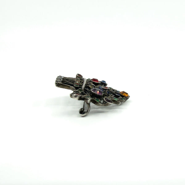 Side angle of sterling silver giardinetti brooch showing setting height and pin hook fitting.
