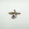 Side view of gold-plated heart with key and cross charm in silver