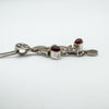 Side view showing depth of carnelian and marcasite floral pendant