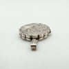 Side angle showing scalloped edges and etched design of silver locket