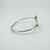Simple side view of oval sterling silver bangle band and structure