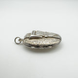 Chunky sterling silver buckle locket showing depth and engraved detail