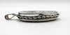 Side view showing locket depth and scalloped silver border