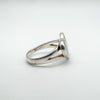Angled side view of sterling silver ring with heart-shaped mother of pearl