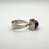 Side angle of silver modernist ring showing bold amethyst ball setting