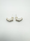 Sculptural half hoop earrings with post and butterfly backs shown