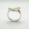 Profile view of sterling silver ring with white mother of pearl heart
