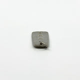 Side view of vintage sterling silver ingot pendant showing slim rectangular shape and jump ring.