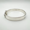 Side profile of heavy sterling silver bangle with curved design