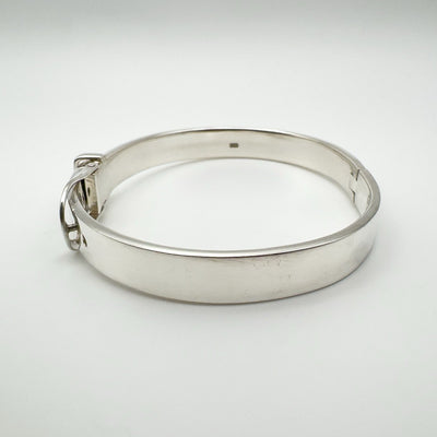 Side profile of heavy sterling silver bangle with curved design