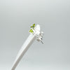Side angle of green CZ studs in sterling silver 925 on display