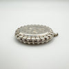 Side profile showing depth and chunky shape of vintage silver locket