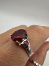 Close-up showing height of ruby and side stones when worn on hand