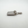 Side view showing spiral-bound design of sterling silver notebook pendant