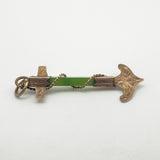 Side angle of antique rose gold anchor pendant with central green jade