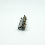 Side profile of antique sterling silver bar brooch showing the pin and clasp height.