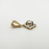Side view of rose cut diamond set in platinum with gold bale