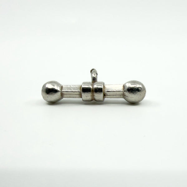 Side profile showing the bail loop attached to the sterling silver T-bar pendant.