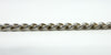 Side profile photo of sterling silver curb chain links showing thickness and rounded edges.