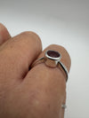 Profile shot showing raised bezel and ruby sparkle while worn
