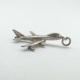 Side profile of the vintage aircraft pendant showing full body and wing detail