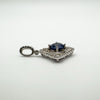 Side view of blue CZ pendant with raised pavé setting