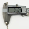 Caliper showing the fine link thickness on a vintage sterling silver bracelet at approximately 0.4mm