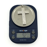 Vintage sterling silver engraved cross pendant shown weighing approximately 9.2g.