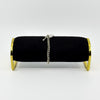 Side view of vintage sterling silver curb bracelet on black display stand with heart padlock visible.