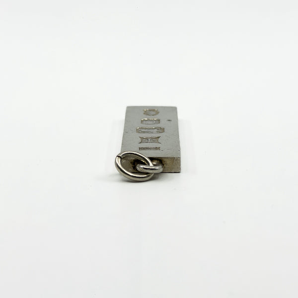 Close up of the bail and top edge on vintage sterling silver ingot pendant