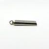 Angled side view of the silver ingot pendant showing the thick edge and hallmark panel.
