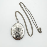 Full view of silver locket pendant with 24 inch curb chain and clasp