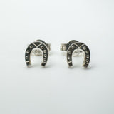 Pair of sterling silver mini horseshoe stud earrings front view