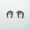 Pair of sterling silver mini horseshoe stud earrings front view