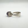Side detail of vintage silver ring with amethyst, showing band and setting