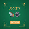 Pair of silver oval lockets with engraved design on green background