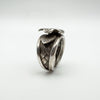 Close-up of plaited band and leaf on chunky sterling silver floral ring