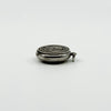 Side view of vintage sterling silver Virgin Mary photo locket with jump ring and raised front detail.